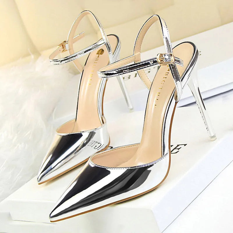 Patent Leather Stiletto Pumps - Women's Pointed Party Heels on display with a shiny black finish and elegant buckle strap.