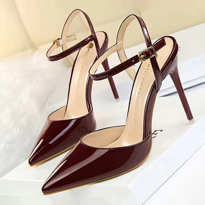 Patent Leather Stiletto Pumps - Women's Pointed Party Heels on display with a shiny black finish and elegant buckle strap.