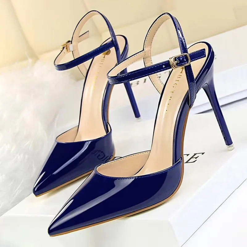 Patent Leather Stiletto Pumps - Women's Pointed Party Heels on display with a shiny black finish and elegant buckle strap.