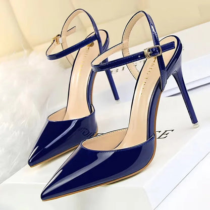 Patent Leather Stiletto Pumps - Women's Pointed Party Heels on display with a shiny black finish and elegant buckle strap.