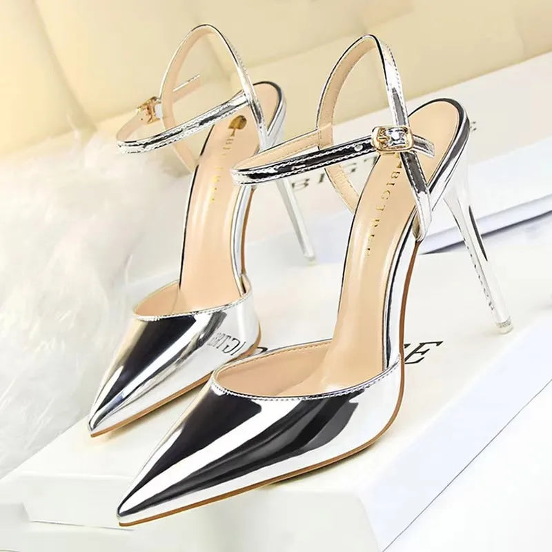 Patent Leather Stiletto Pumps - Women's Pointed Party Heels on display with a shiny black finish and elegant buckle strap.