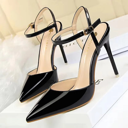 Patent Leather Stiletto Pumps - Women's Pointed Party Heels on display with a shiny black finish and elegant buckle strap.