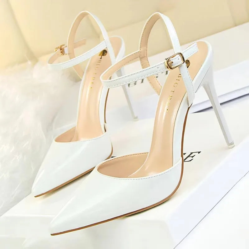 Patent Leather Stiletto Pumps - Women's Pointed Party Heels on display with a shiny black finish and elegant buckle strap.